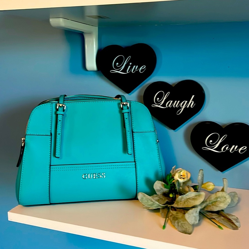 Guess brand turquoise hand bag.